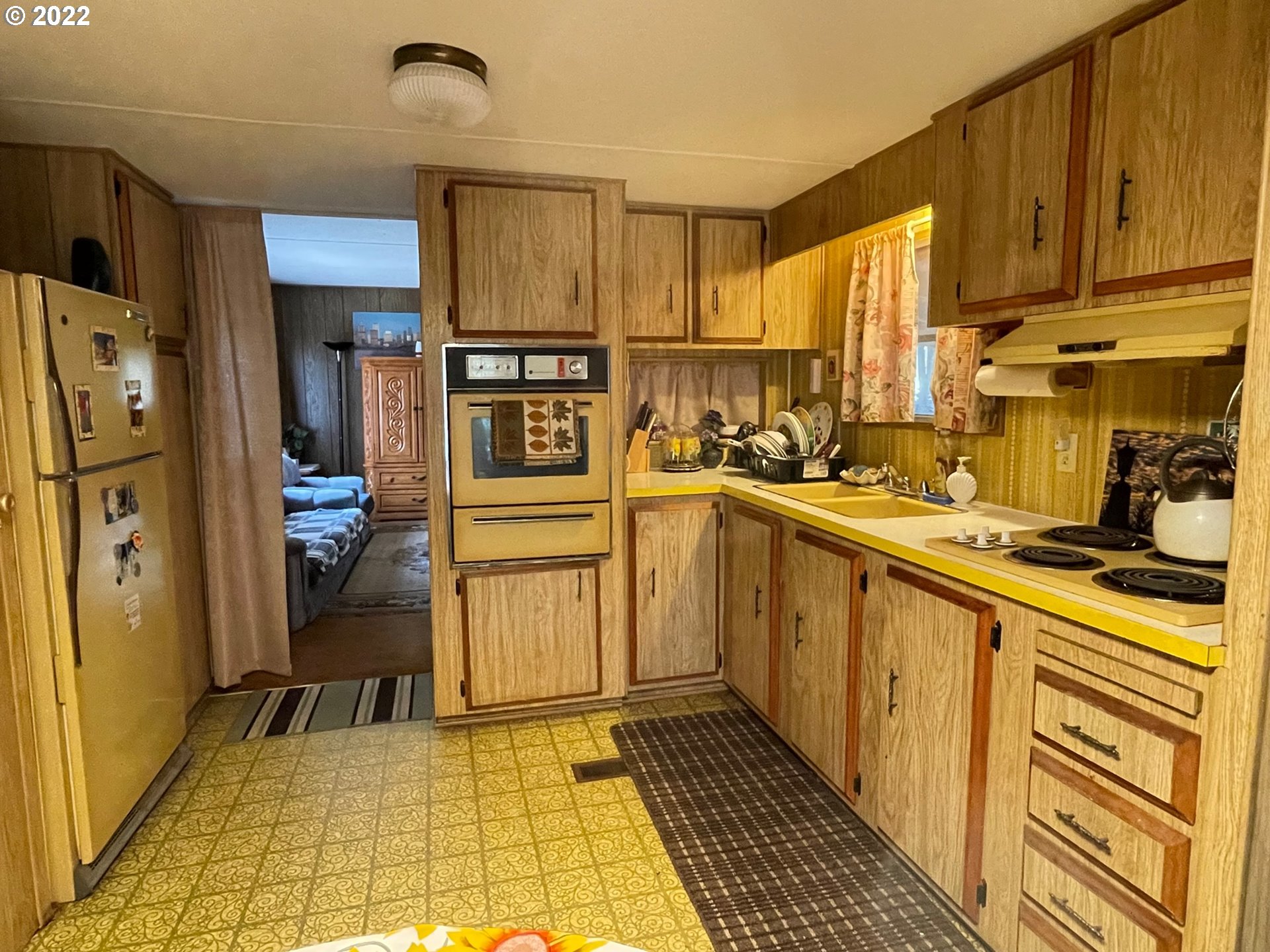 235 Lake View Loop Tygh Valley, OR 97063 - Photo 7 of 24 a kitchen with stainless steel appliances a refrigerator sink and cabinets