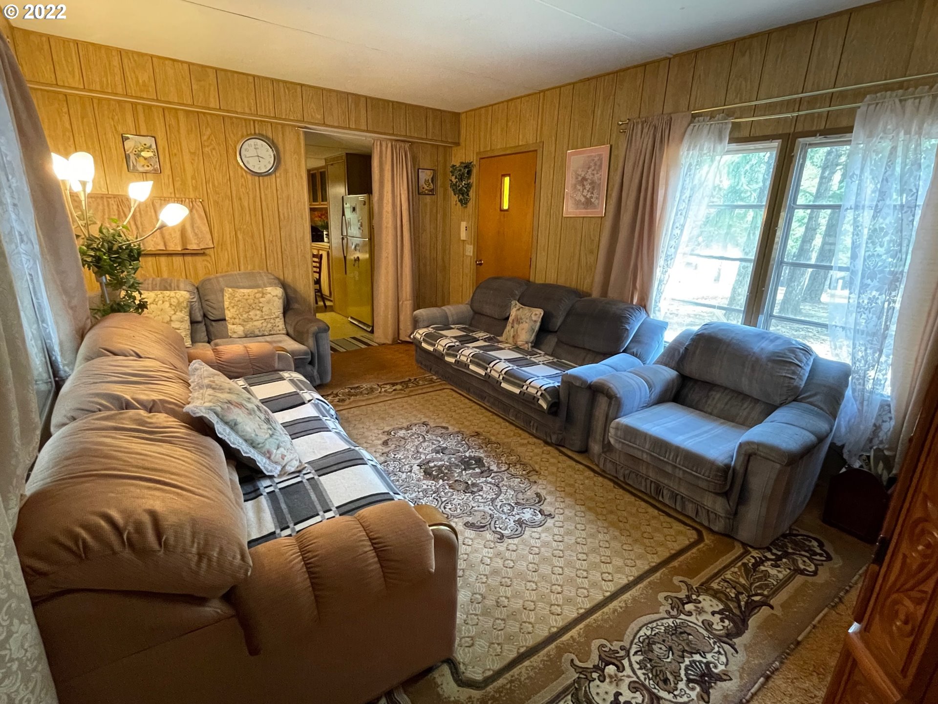 235 Lake View Loop Tygh Valley, OR 97063 - Photo 9 of 24 a living room with furniture and a large window