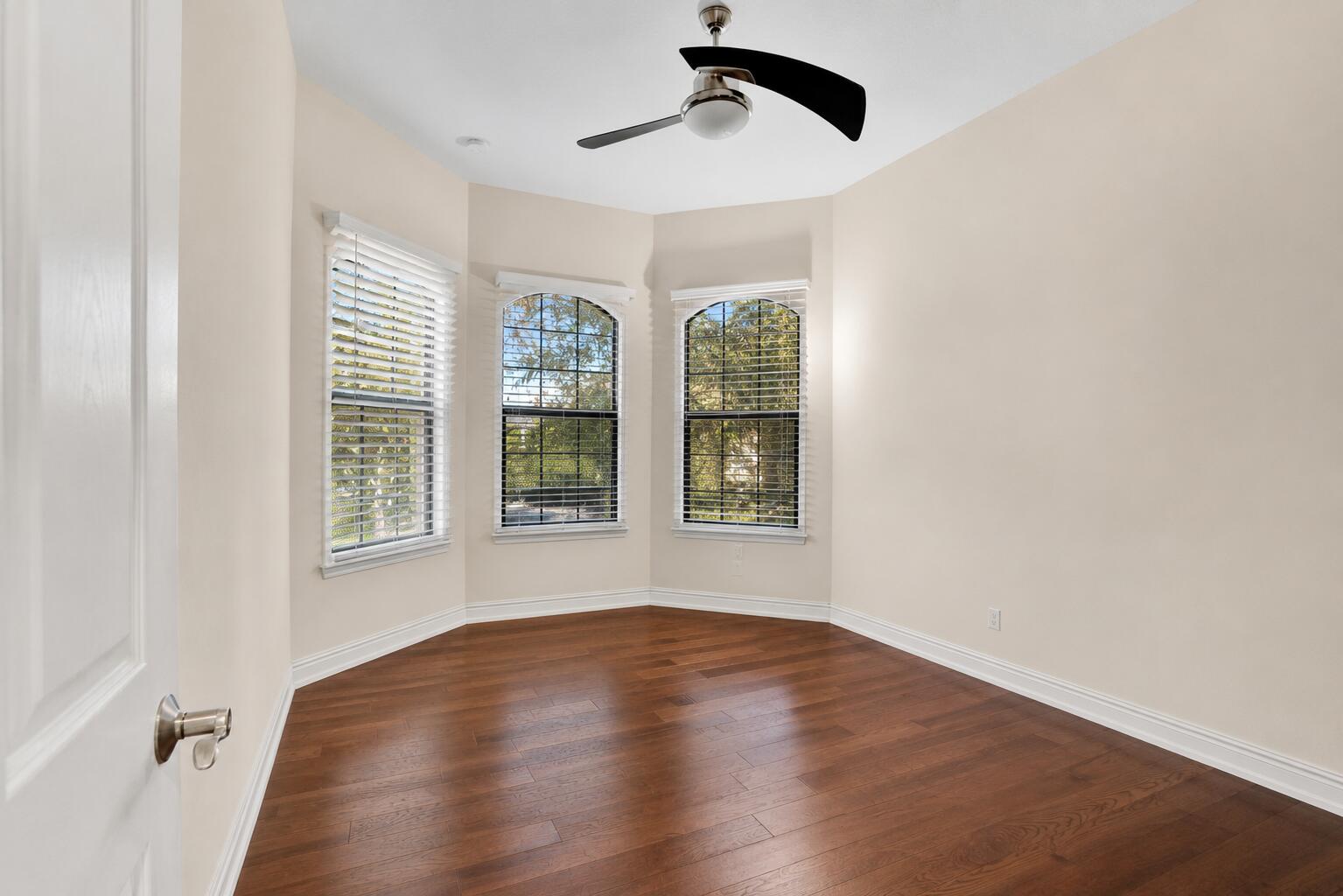 16610 Gateway Bridge Drive Delray Beach, FL 33446 - Photo 30 of 67 a view of an empty room with wooden floor and a window