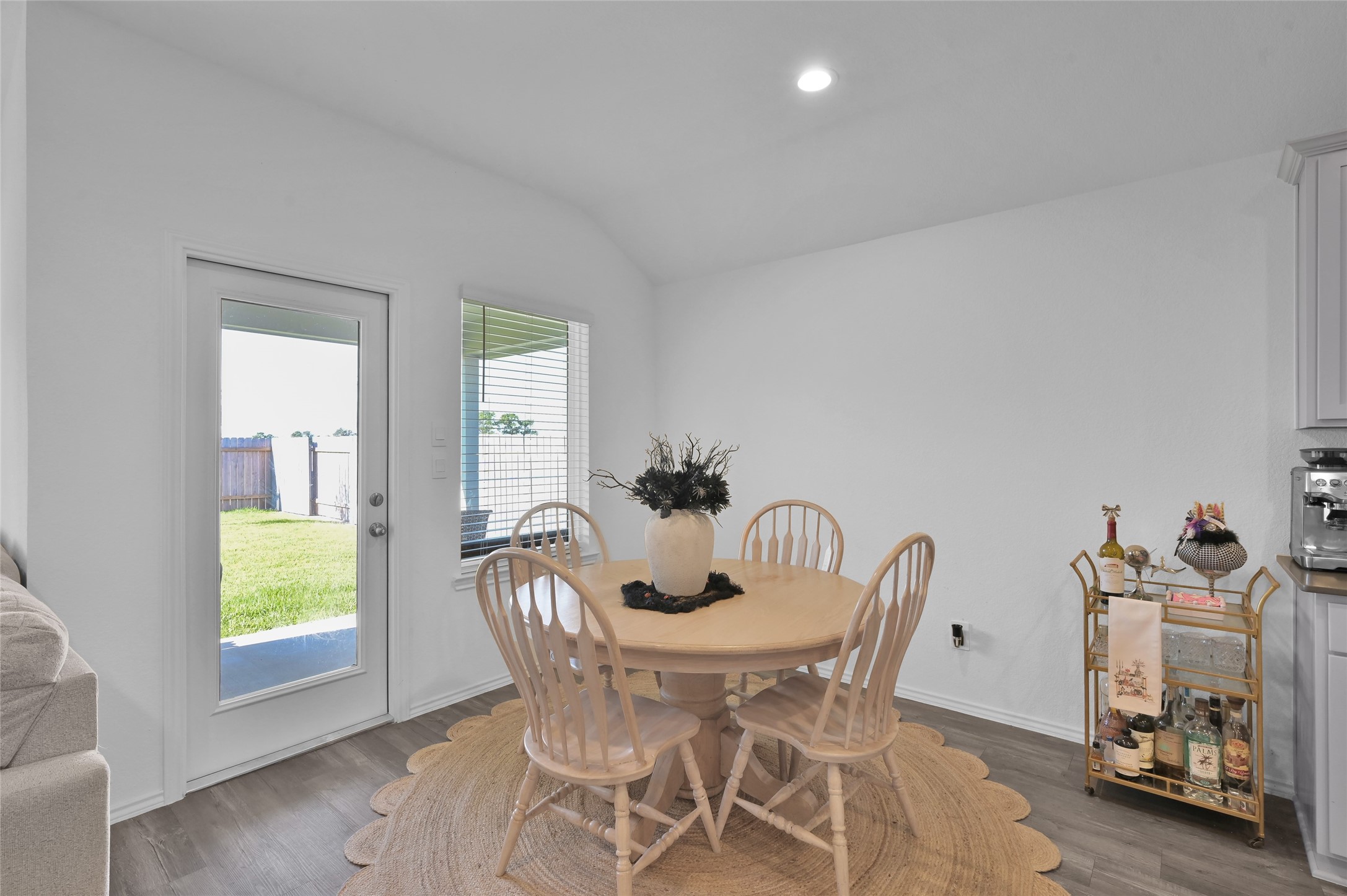 12369 Carib Crossing Lane Conroe, TX 77304 - Photo 16 of 43 a view of a dining room with furniture and a window