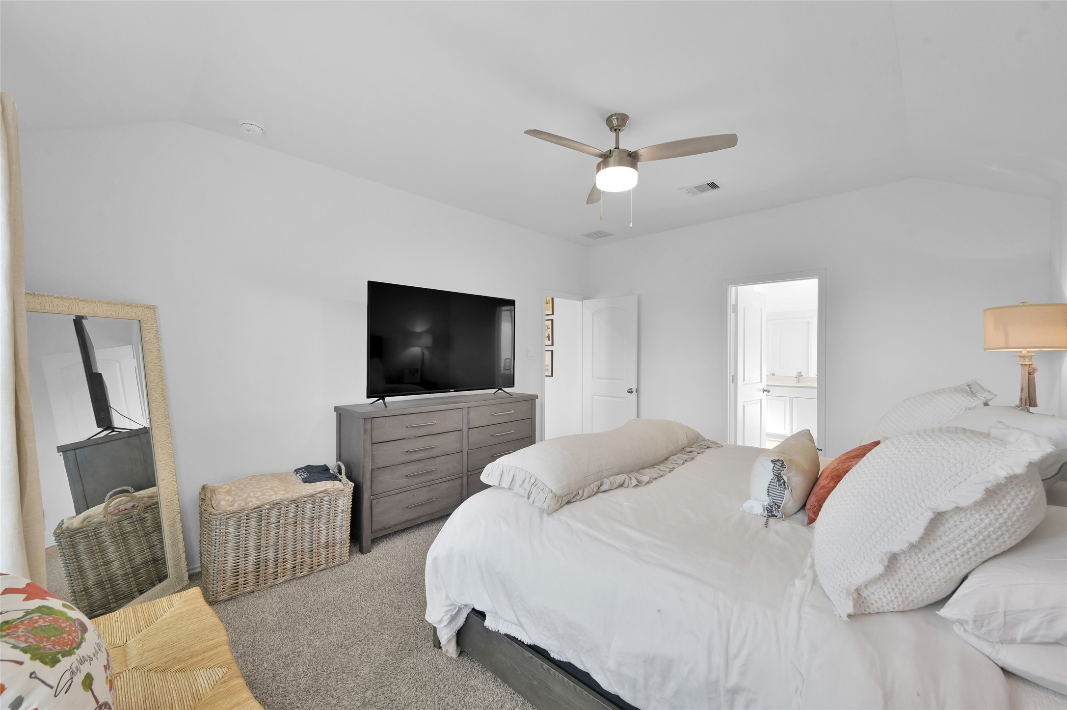 12369 Carib Crossing Lane Conroe, TX 77304 - Photo 22 of 43 a bedroom with a bed and a couch