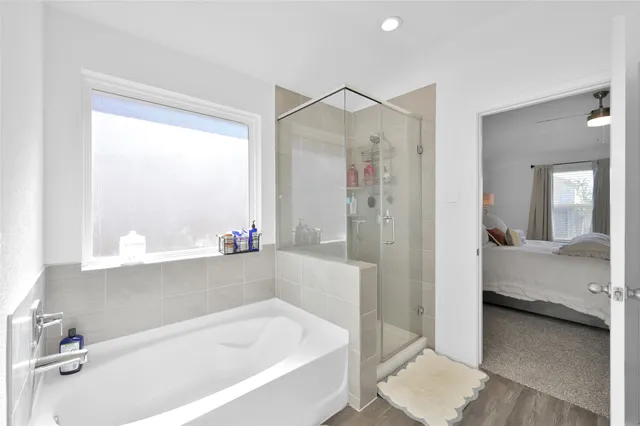 a bathroom with a bathtub and a shower