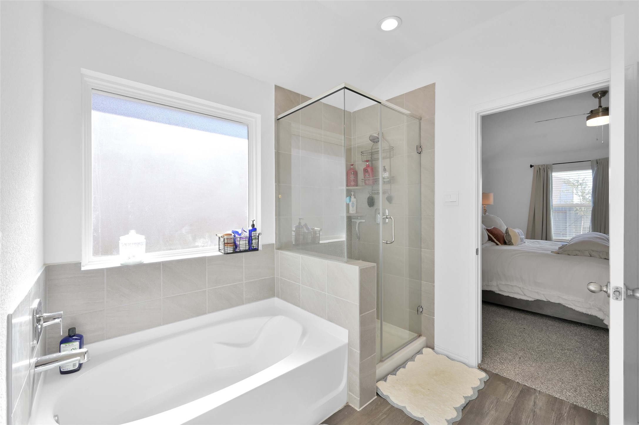 12369 Carib Crossing Lane Conroe, TX 77304 - Photo 23 of 43 a bathroom with a bathtub and a shower