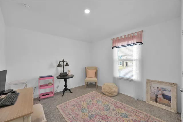 a bedroom with furniture and a window