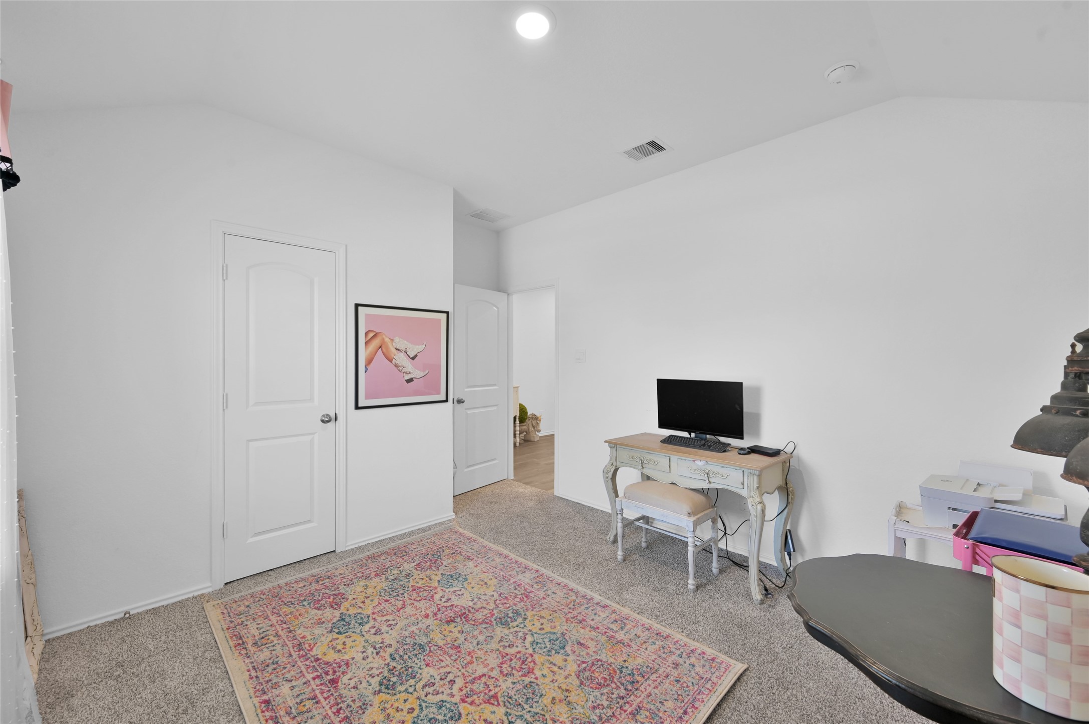 12369 Carib Crossing Lane Conroe, TX 77304 - Photo 27 of 43 a view of a workspace with furniture and a flat screen tv