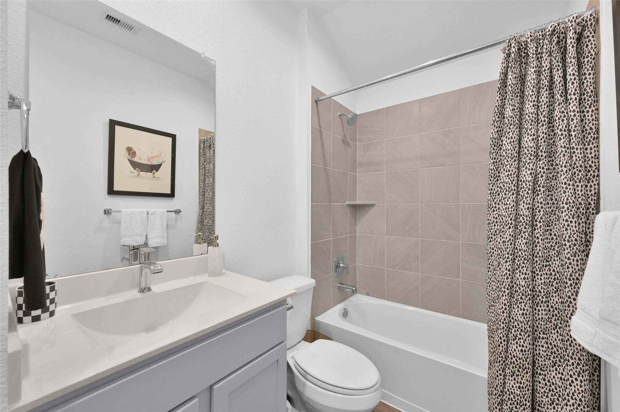 12369 Carib Crossing Lane Conroe, TX 77304 - Photo 28 of 43 a bathroom with a sink a toilet and shower