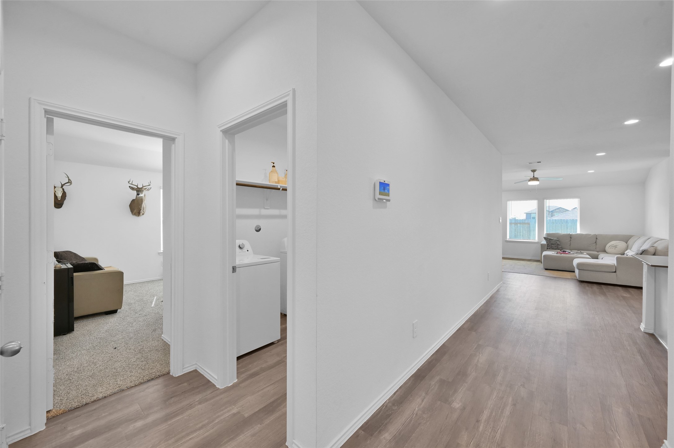 12369 Carib Crossing Lane Conroe, TX 77304 - Photo 31 of 43 a living room with furniture and a wooden floor