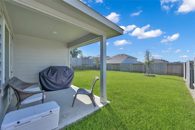 a view of an chairs and table in the patio