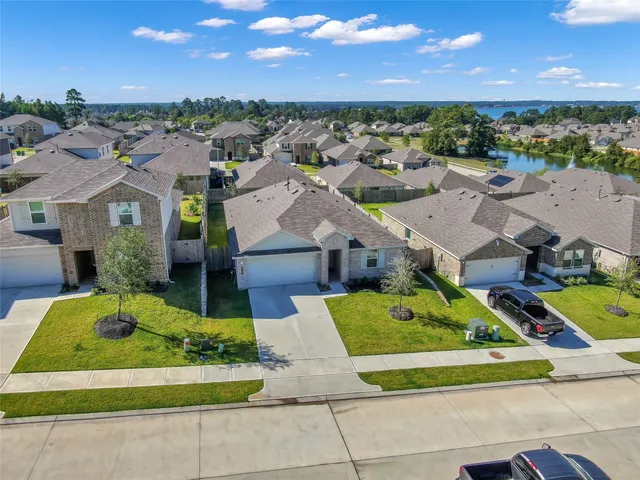 an aerial view of a house with a garden