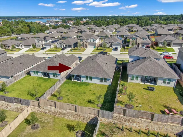 a view of residential houses with outdoor space and swimming pool