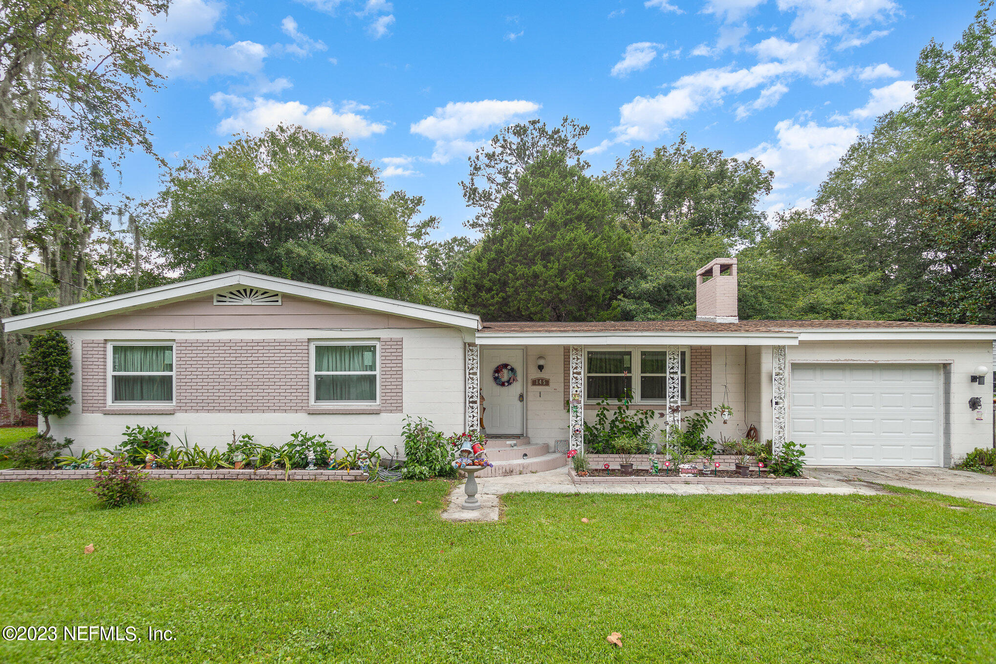 145 North Orange Street Starke, FL 32091 - Photo 1 of 26 a front view of house with yard and green space
