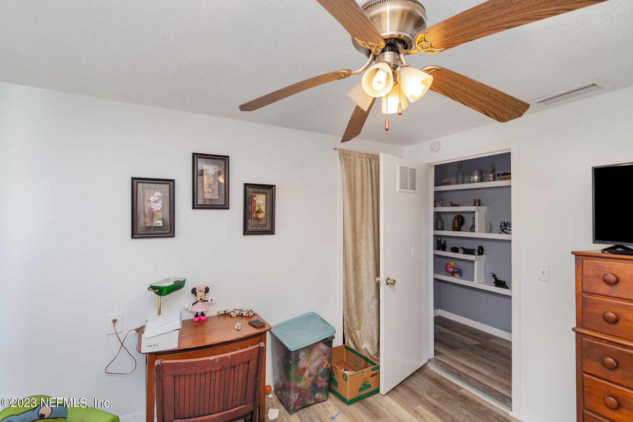 145 North Orange Street Starke, FL 32091 - Photo 14 of 26 a room with furniture and a window