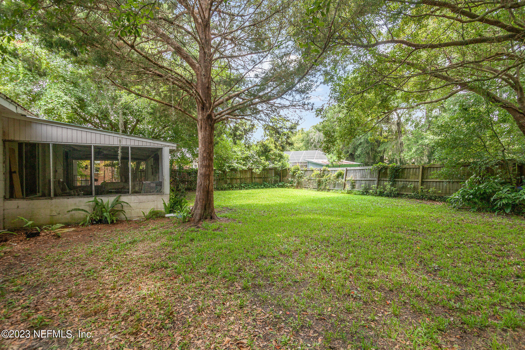 145 North Orange Street Starke, FL 32091 - Photo 24 of 26 a view of a yard with a house and large trees