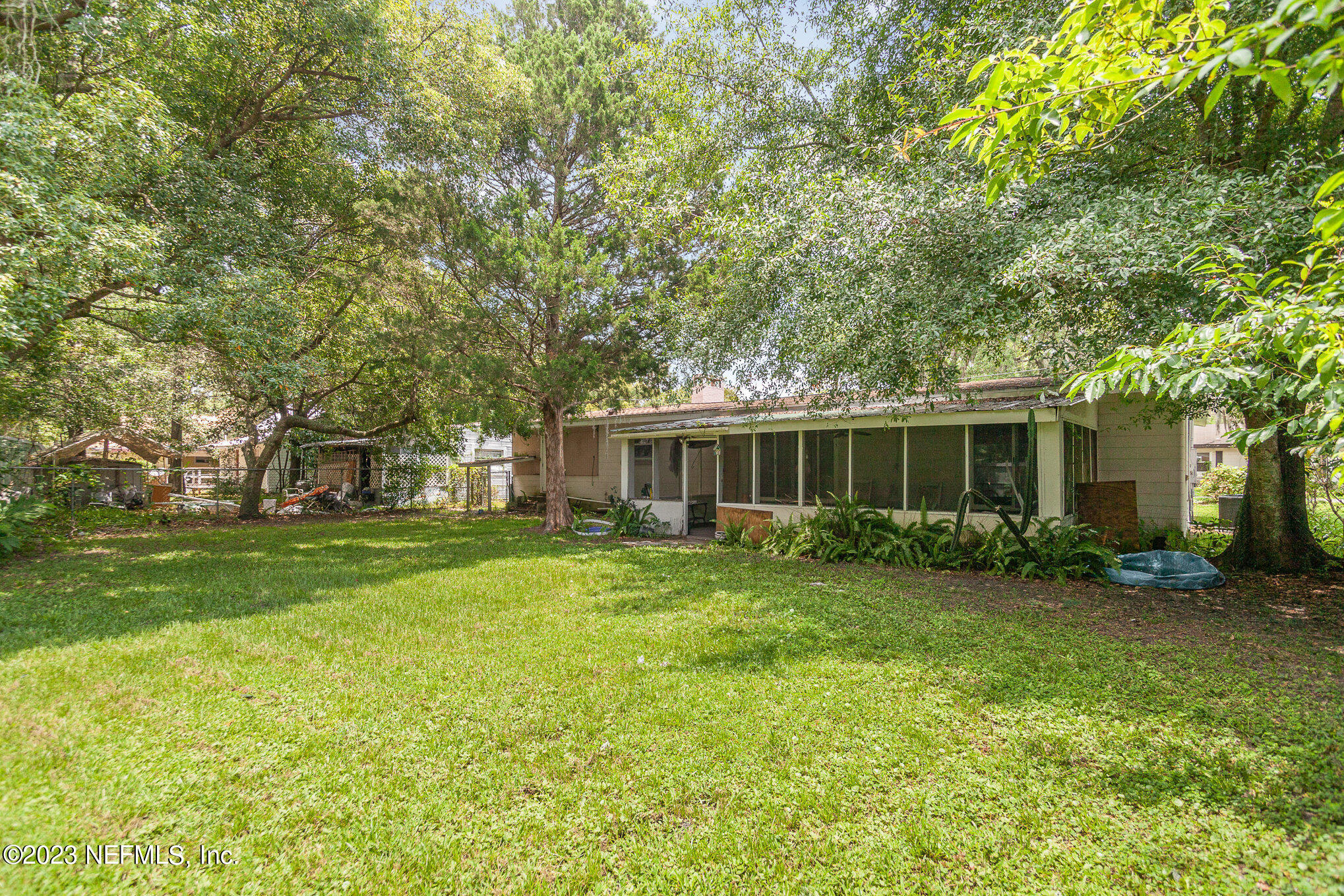 145 North Orange Street Starke, FL 32091 - Photo 26 of 26 a view of a house with a backyard