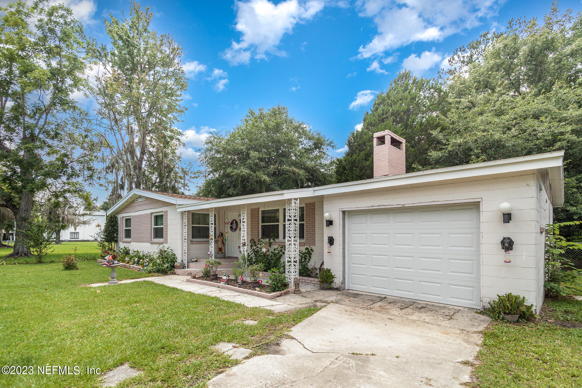 145 North Orange Street Starke, FL 32091 - Photo 3 of 26 a view of house with outdoor space and garden