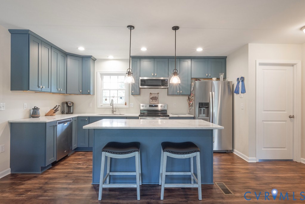 4336 Hells Bend Road Palmyra, VA 22963 - Photo 7 of 35 Kitchen featuring blue cabinetry, a central island