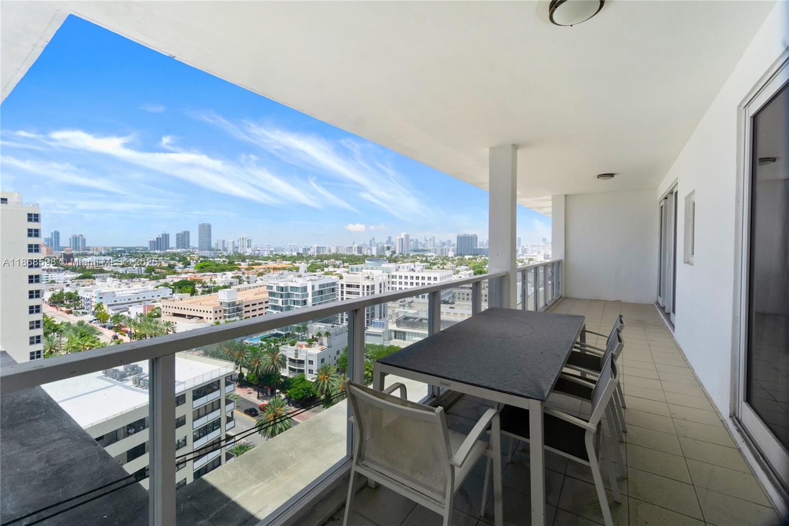 a view of a balcony dining table and chairs