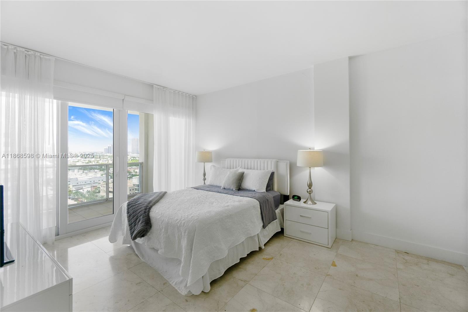 100 Lincoln Road, Unit PH14 Miami Beach, FL 33139 - Photo 13 of 33 a bedroom with a bed and large window