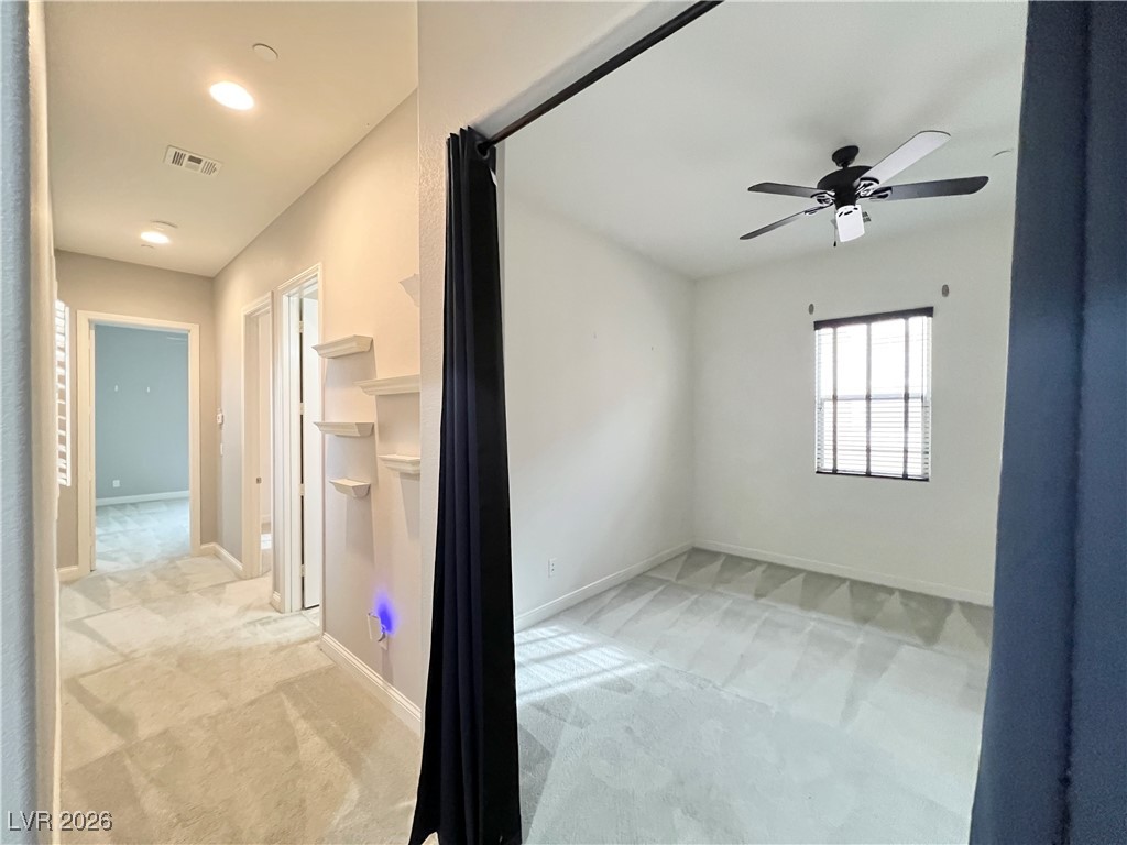 2117 Thames View Street Henderson, NV 89044 - Photo 24 of 50 Den and hallway to bathroom, 2nd and 3rd bedrooms