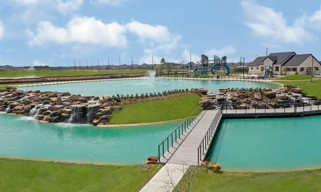 a view of a swimming pool with a lake view