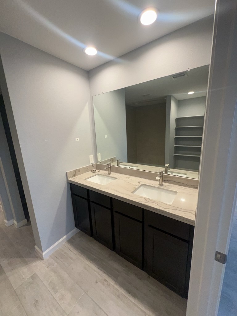 5327 Cherry Tallow Trail Katy, TX 77449 - Photo 11 of 18 a bathroom with double vanity sink and a mirror