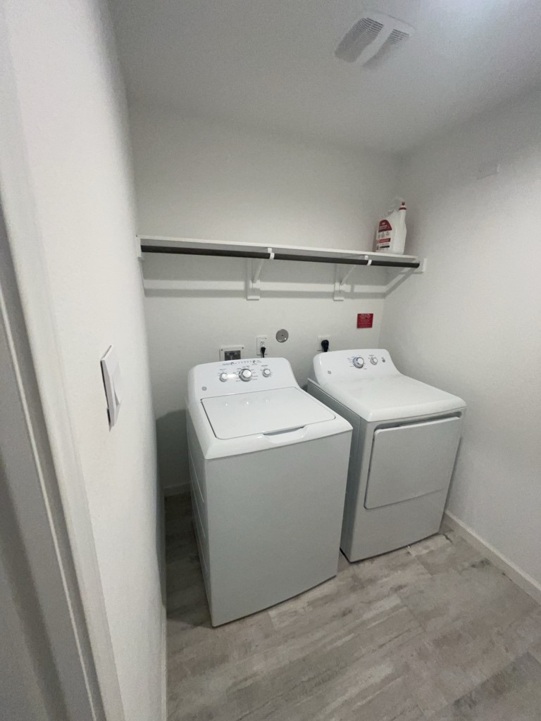 5327 Cherry Tallow Trail Katy, TX 77449 - Photo 15 of 18 a utility room with dryer and washer
