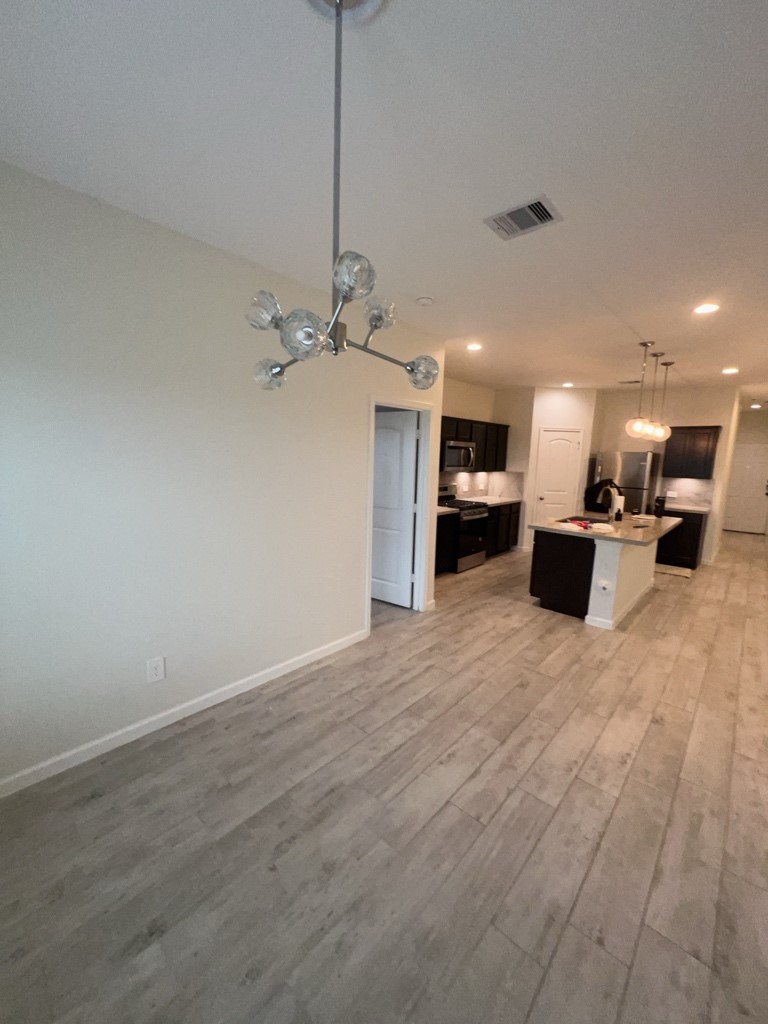 5327 Cherry Tallow Trail Katy, TX 77449 - Photo 2 of 18 a view of a kitchen with a sink and a stove top oven