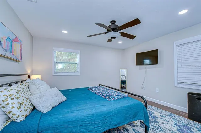 a bedroom with a bed and a window