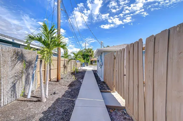 a view of a pathway with a house