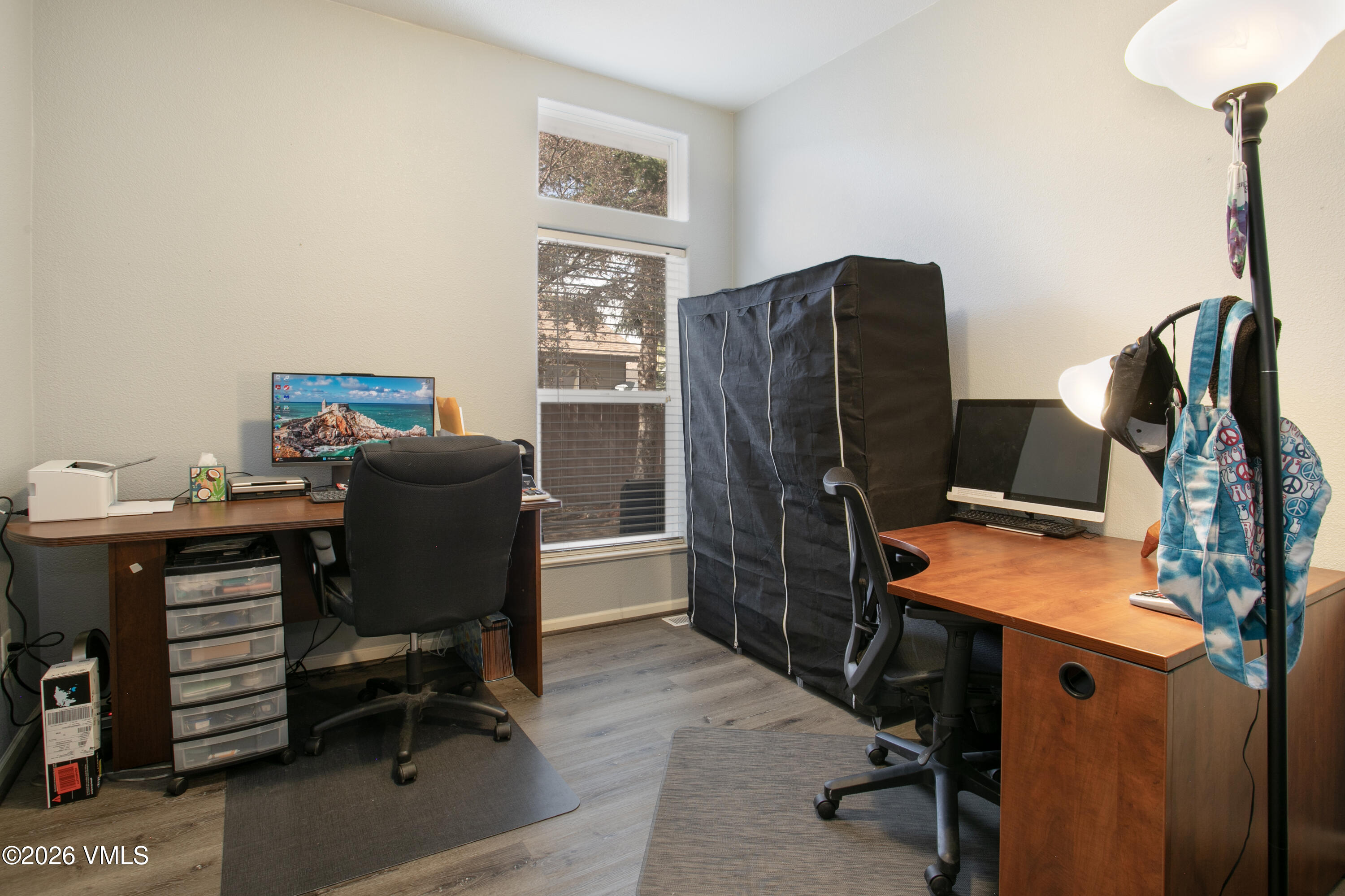 161 Haymaker Loop Gypsum, CO 81637 - Photo 13 of 40 a view of a workspace with furniture and a window