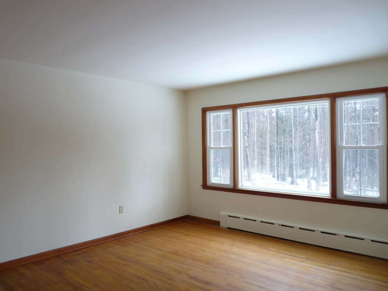 19 Christian Hill Road Stockbridge, MA 01262 - Photo 3 of 16 an empty room with wooden floor and windows