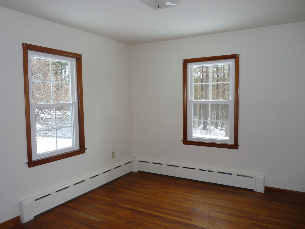 19 Christian Hill Road Stockbridge, MA 01262 - Photo 8 of 16 a view of an empty room with wooden floor and a window