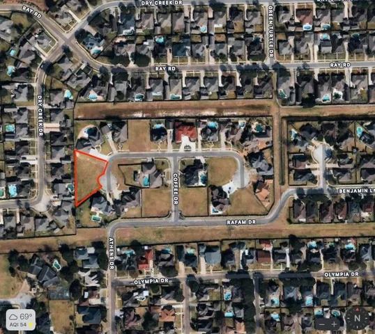 a picture of a room with a white wall and a painting