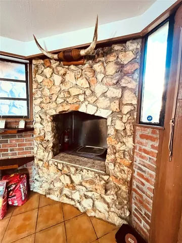 a living room with a flat screen tv and a fireplace