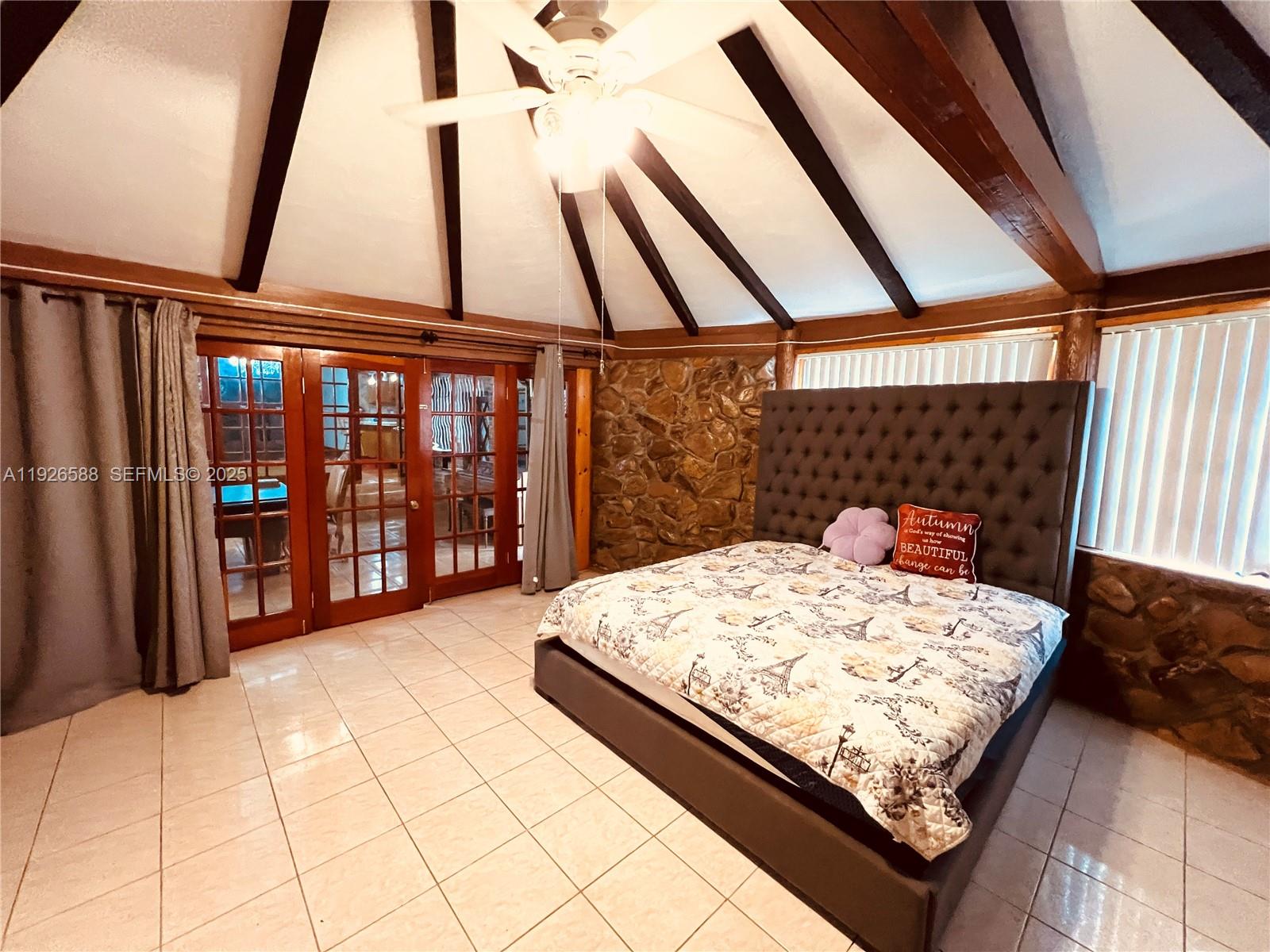 29625 Southwest 153rd Court Homestead, FL 33033 - Photo 13 of 17 a bed sitting in a bedroom next to a window