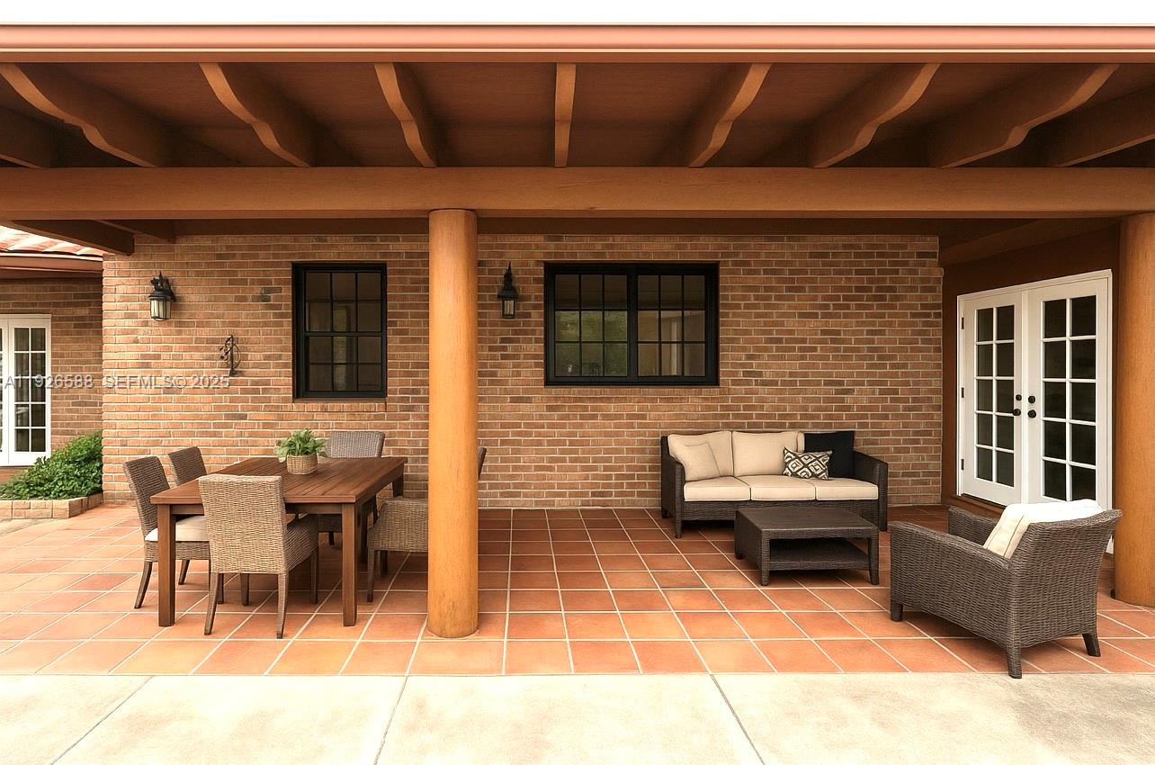 29625 Southwest 153rd Court Homestead, FL 33033 - Photo 17 of 17 a view of a patio with table and chairs