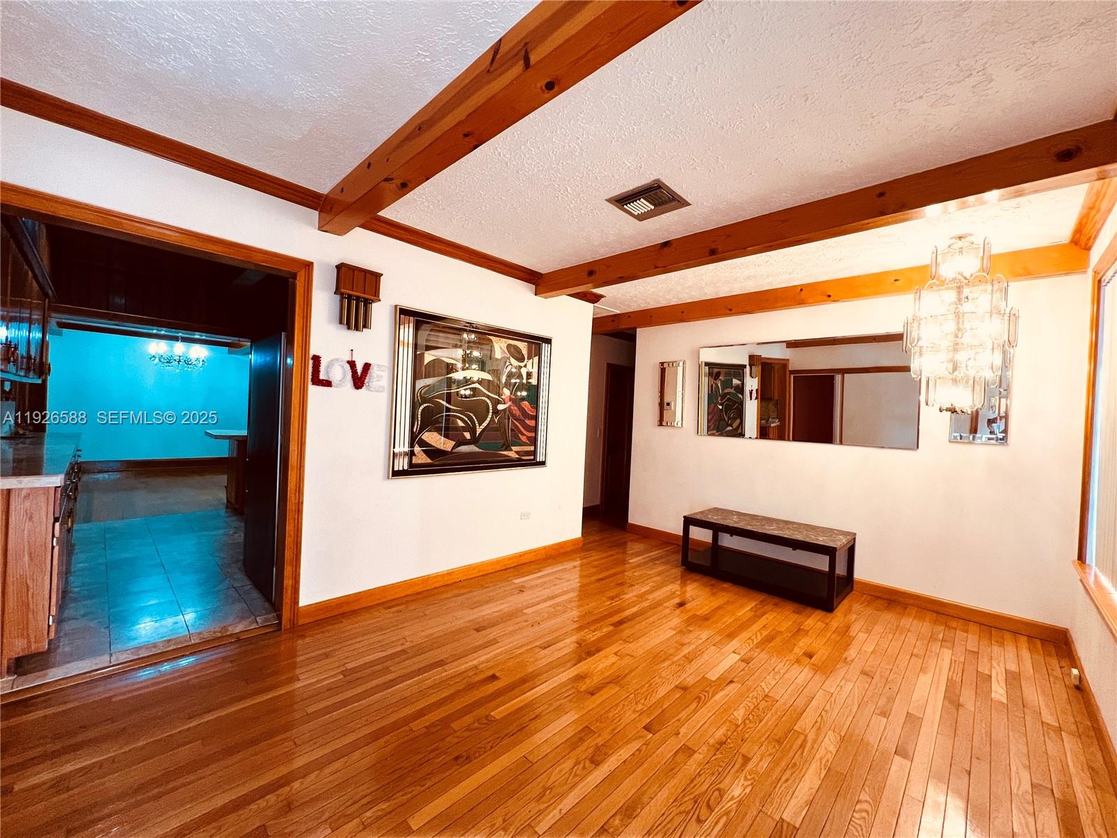 29625 Southwest 153rd Court Homestead, FL 33033 - Photo 3 of 17 a view of a living room with wooden floor and furniture