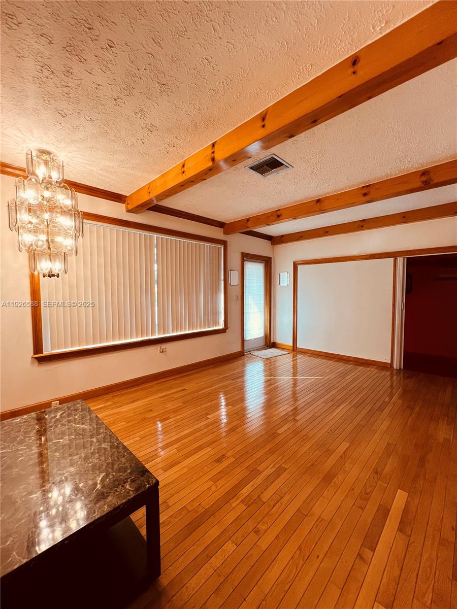 29625 Southwest 153rd Court Homestead, FL 33033 - Photo 7 of 17 a view of a room with wooden floor