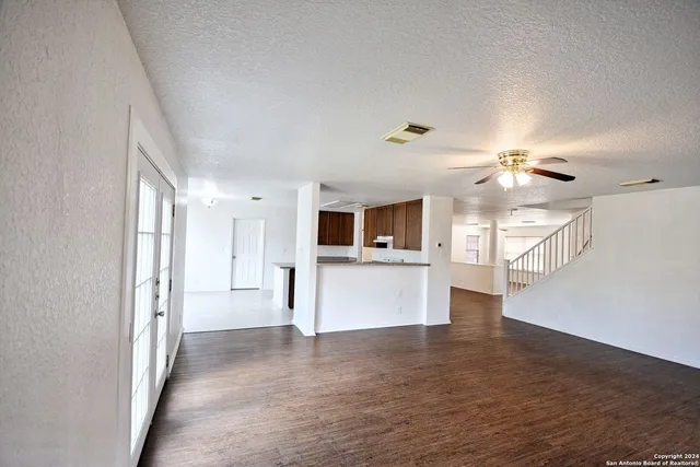 a view of a kitchen with a sink and a window