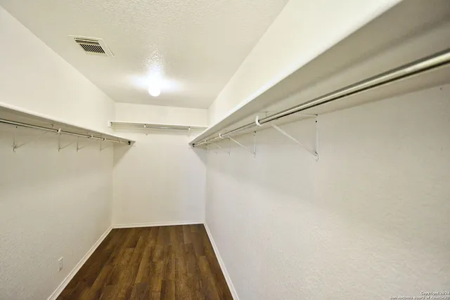 a view of a room with racks on the wall