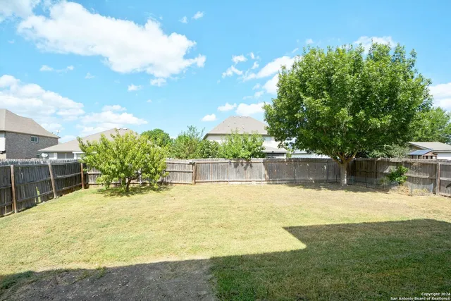 a swimming pool with outdoor seating and garden
