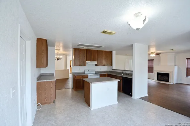 a kitchen with cabinets and stainless steel appliances