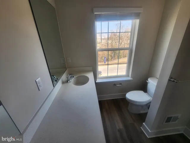 a bathroom with a toilet and a sink
