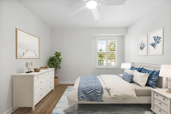a bedroom with bed and window
