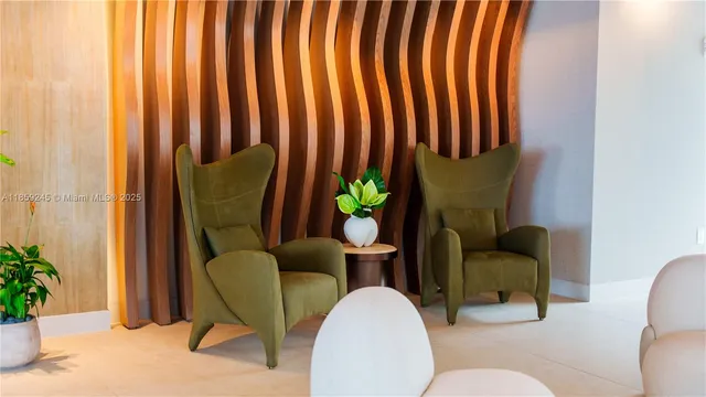 a living room filled with furniture and a potted plant