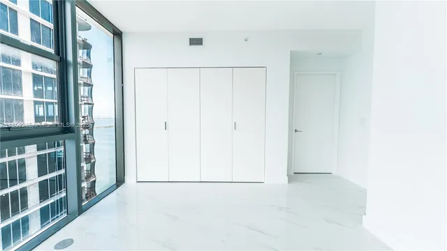 a bathroom with a tub and shower