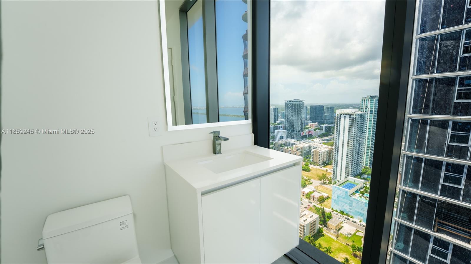 700 Northeast 24th Street, Unit 3401 Miami, FL 33137 - Photo 56 of 68 a utility room with dryer and washer
