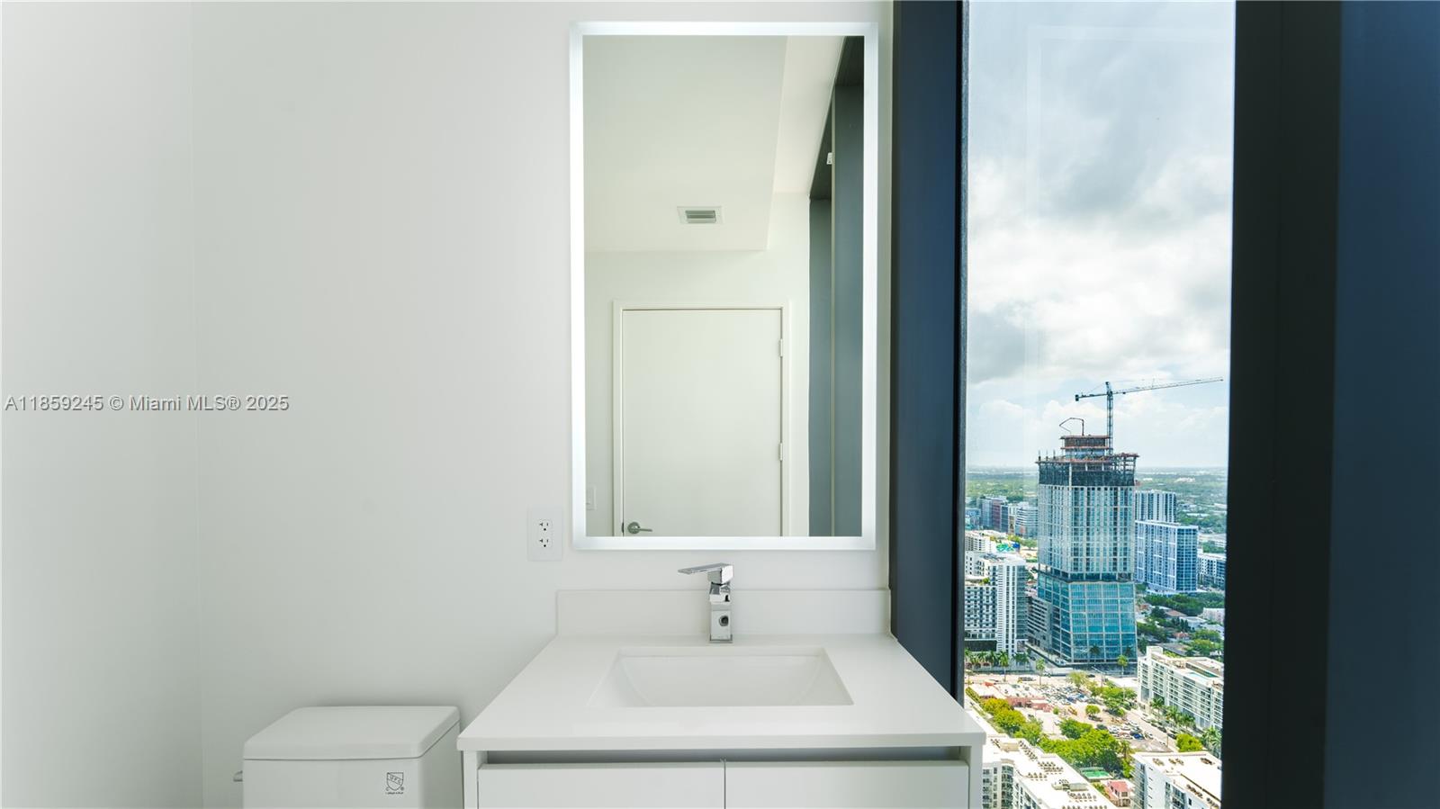 700 Northeast 24th Street, Unit 3401 Miami, FL 33137 - Photo 57 of 68 a bathroom with a sink a toilet and shower