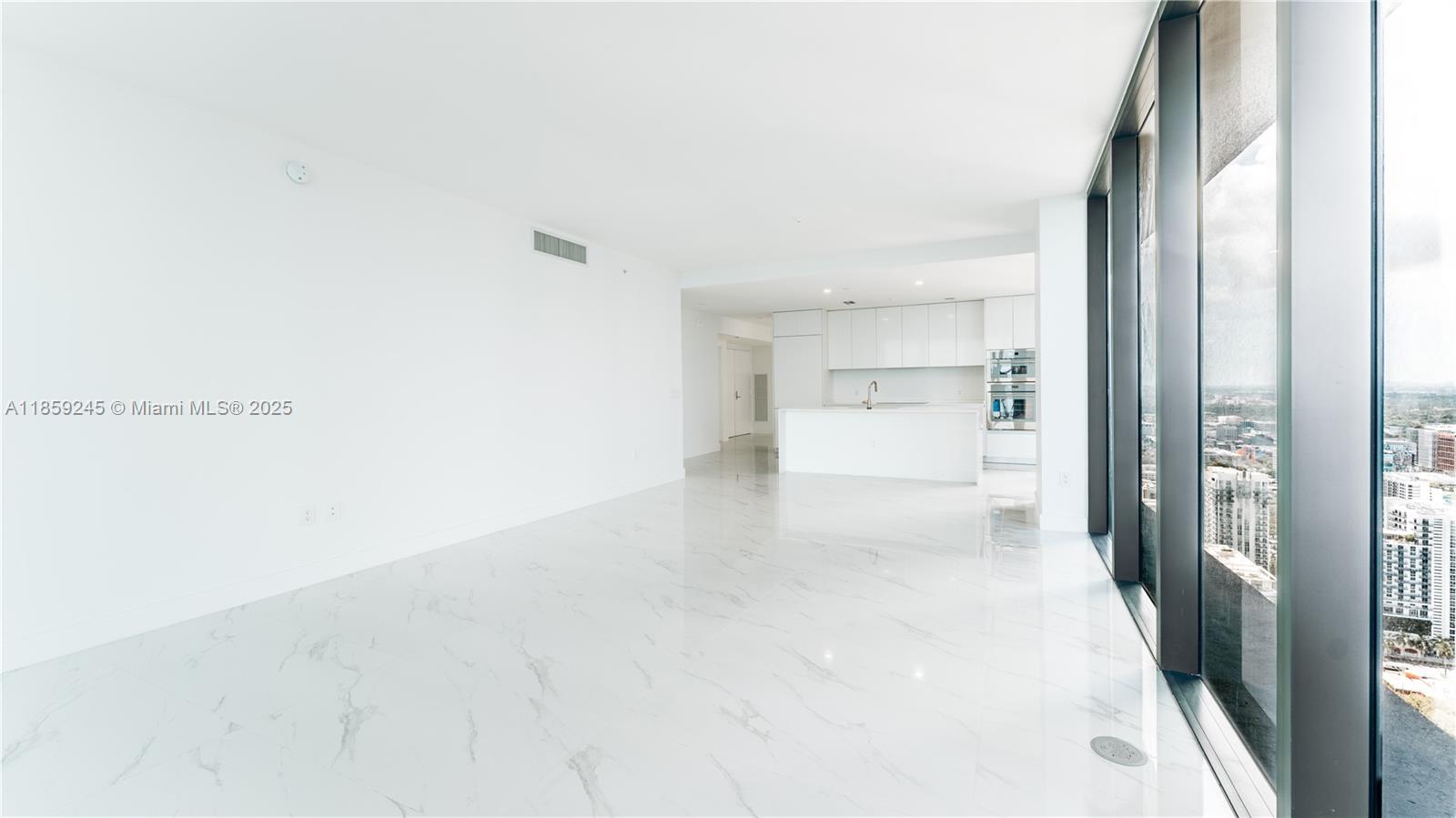 700 Northeast 24th Street, Unit 3401 Miami, FL 33137 - Photo 63 of 68 a view of a hallway with wooden floor