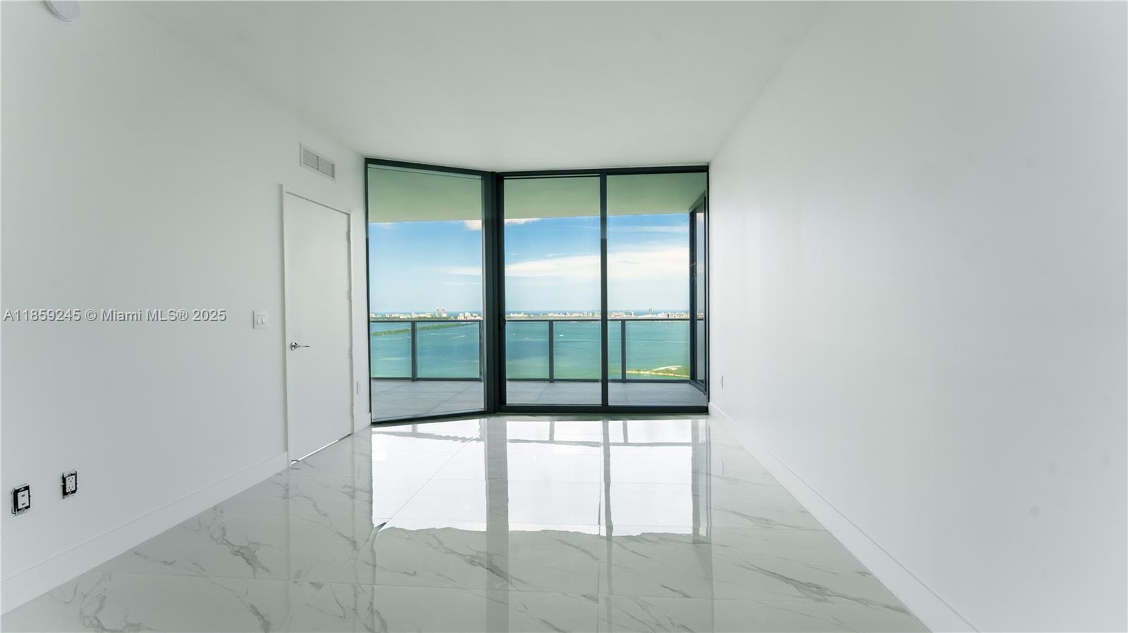 700 Northeast 24th Street, Unit 3401 Miami, FL 33137 - Photo 67 of 68 a bathroom with a glass shower door